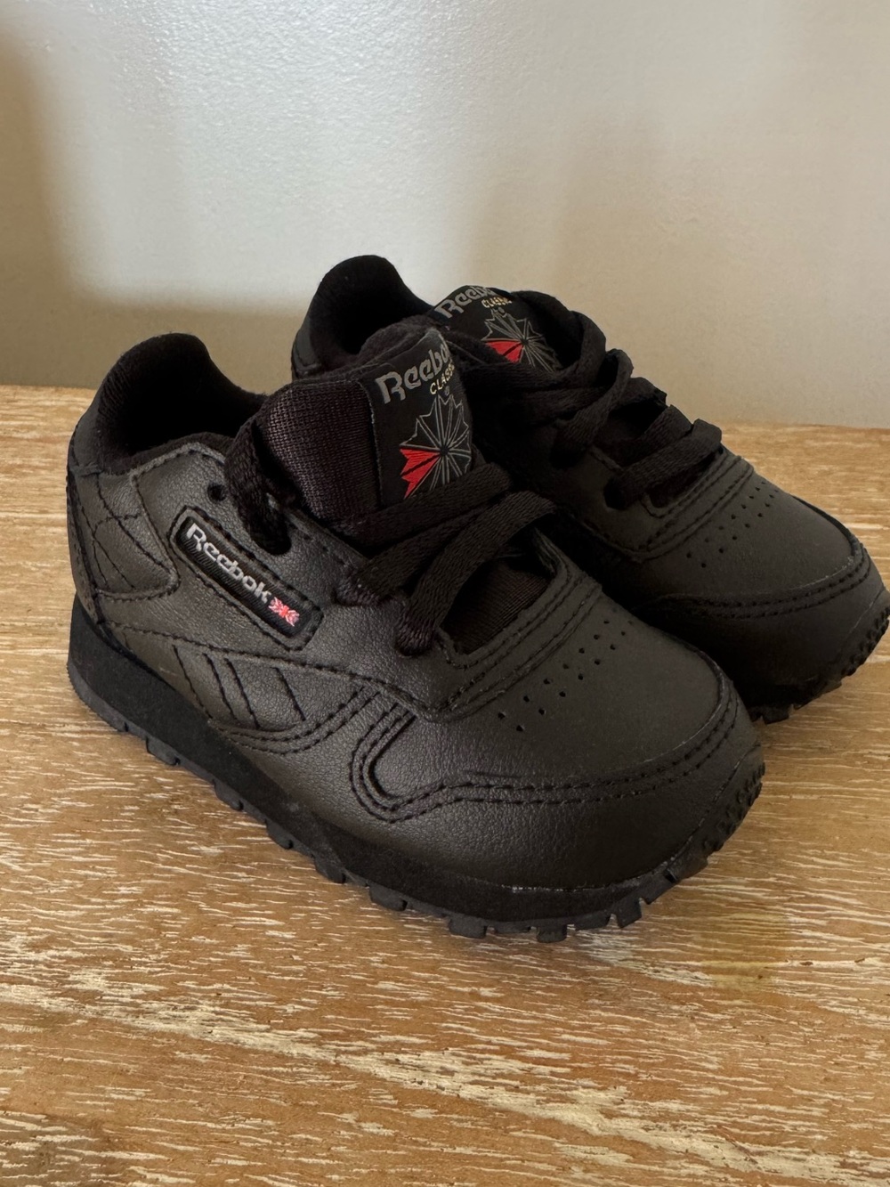 Reebok Kids Black Low-Top Sneakers with Red Logo Accent